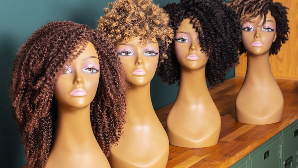 Wigs on mannequins show off the variety of styles to achieve the perfect look
